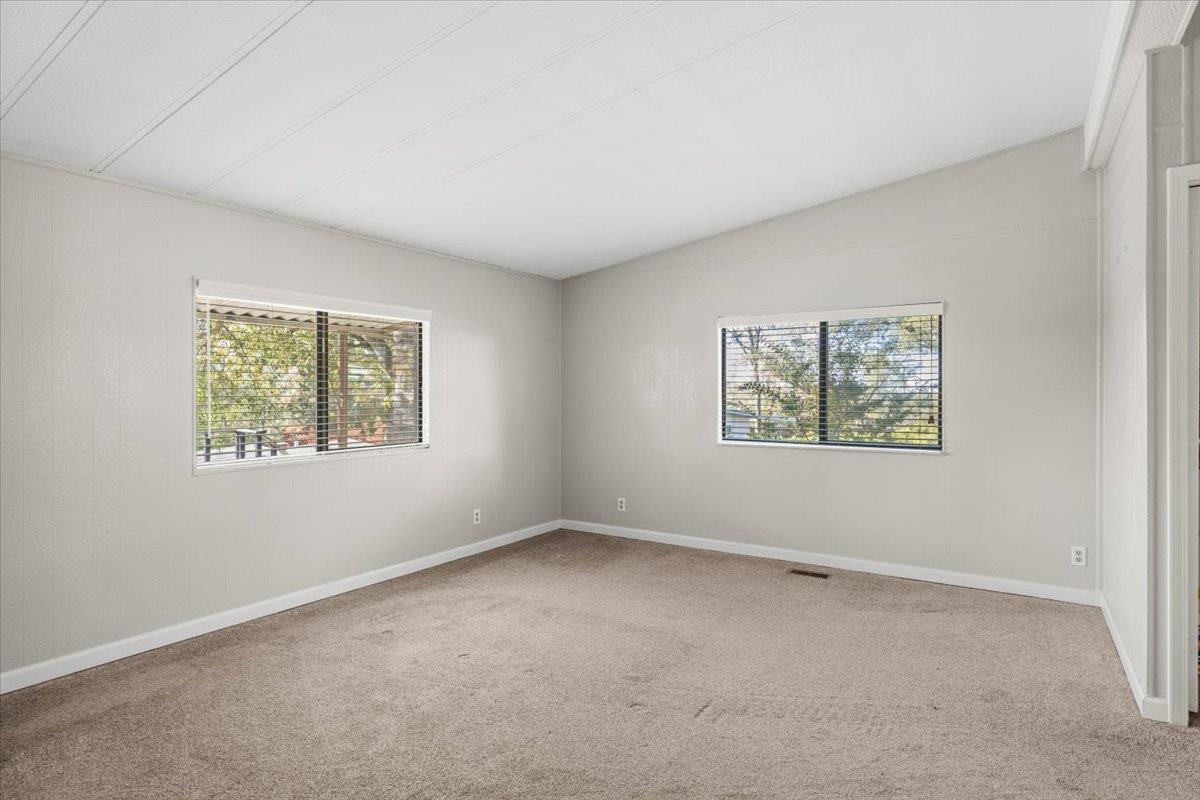 4420 Pleasant Valley Road, Unit 184 Diamond Springs, CA 95619 - Photo 20 of 28 an empty room with windows