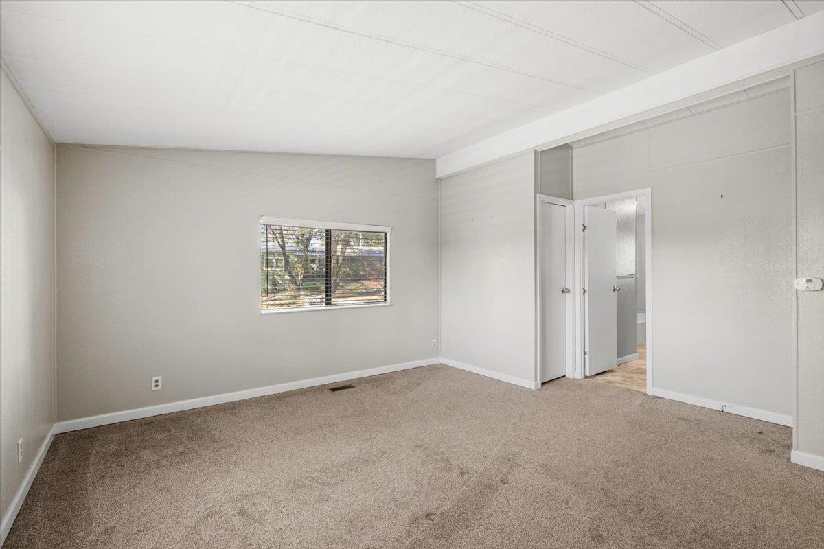 4420 Pleasant Valley Road, Unit 184 Diamond Springs, CA 95619 - Photo 21 of 28 a view of an empty room with a window