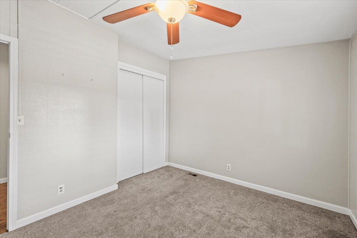 4420 Pleasant Valley Road, Unit 184 Diamond Springs, CA 95619 - Photo 26 of 28 an empty room with chandelier fan
