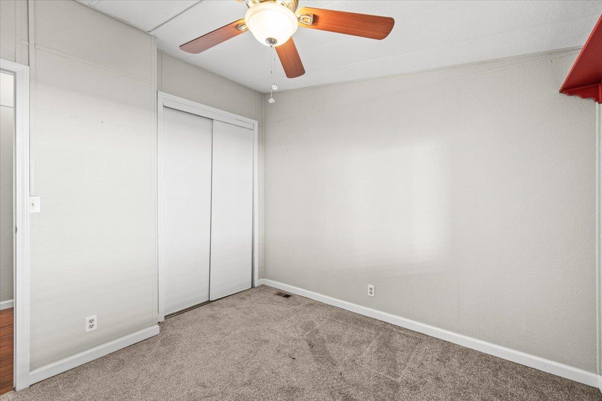 4420 Pleasant Valley Road, Unit 184 Diamond Springs, CA 95619 - Photo 28 of 28 an empty room with windows and fan