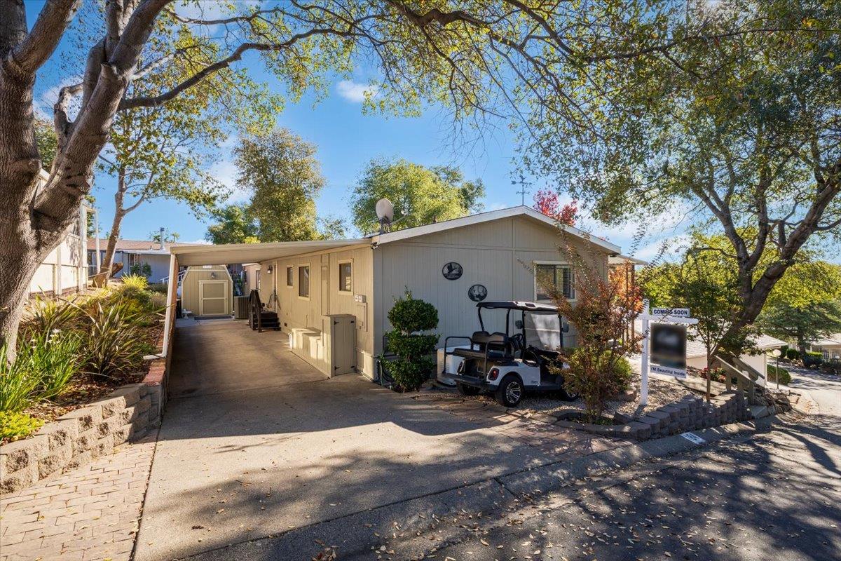 4420 Pleasant Valley Road, Unit 184 Diamond Springs, CA 95619 - Photo 4 of 28 a view of a house with backyard and sitting area