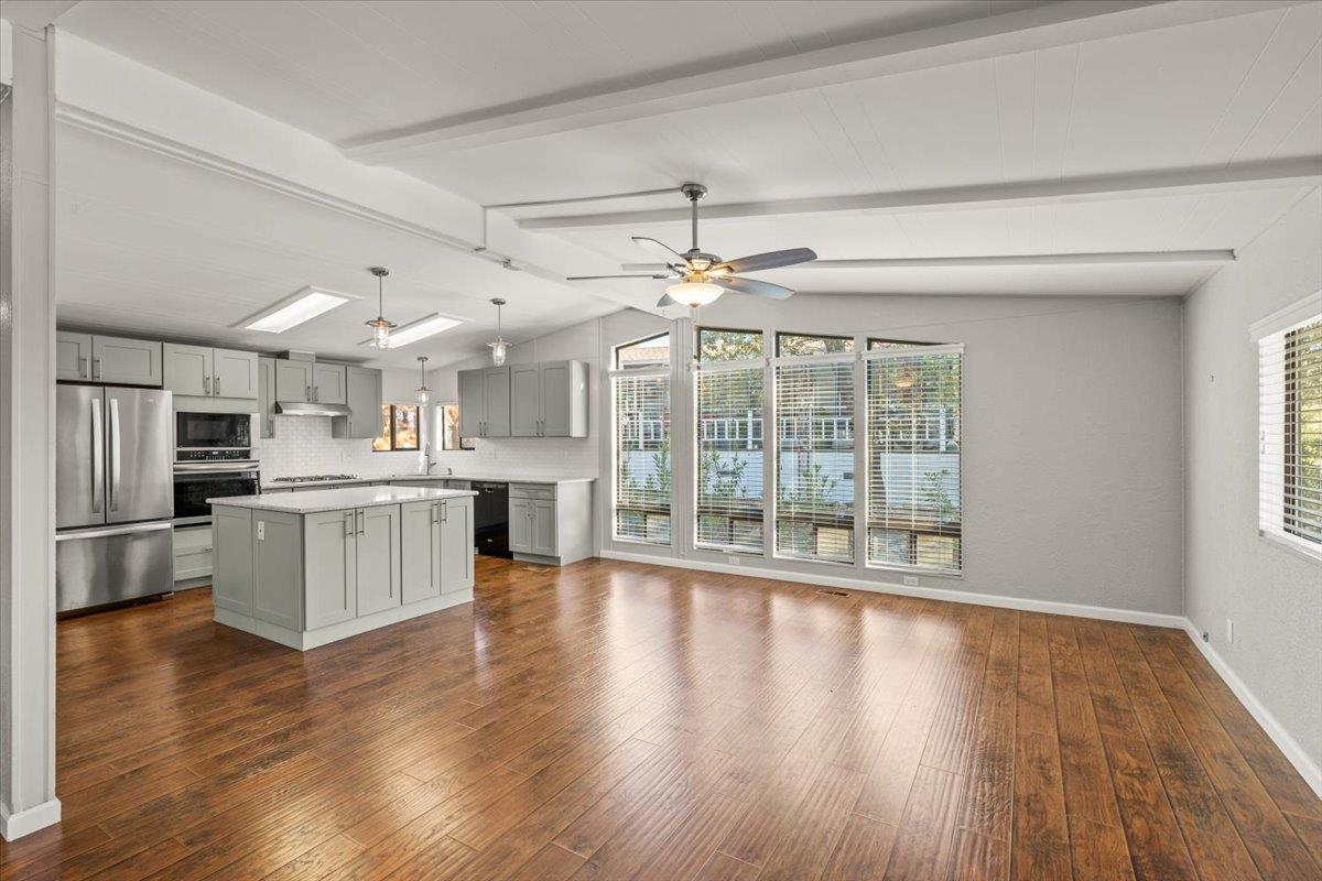 4420 Pleasant Valley Road, Unit 184 Diamond Springs, CA 95619 - Photo 8 of 28 a open kitchen with white cabinets and stainless steel appliances