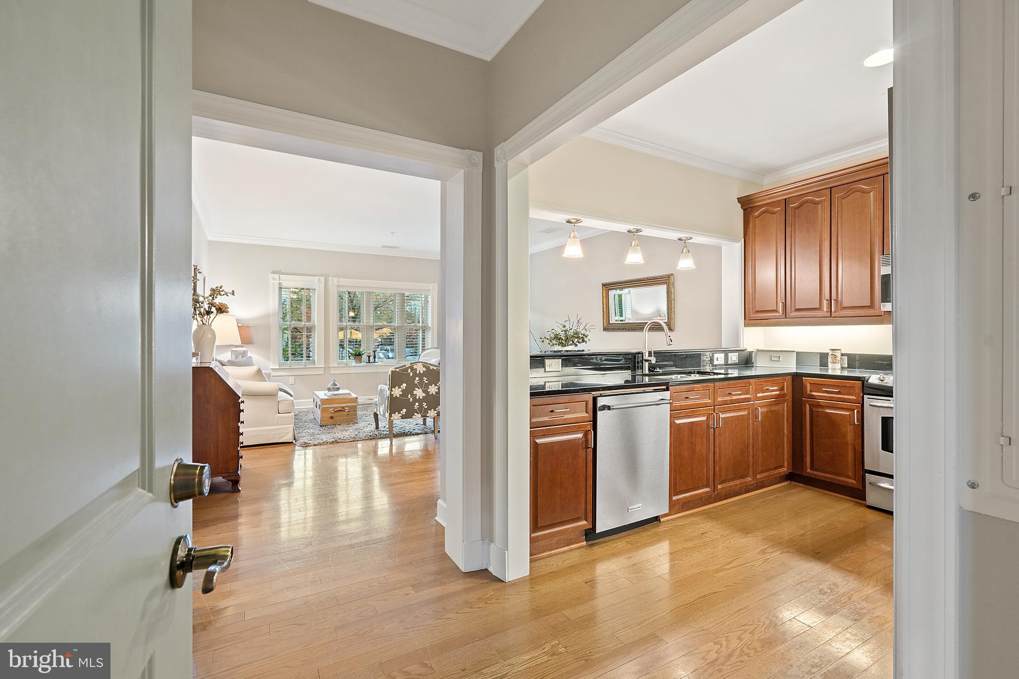 a kitchen with a refrigerator and a sink