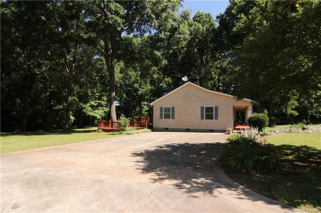 4365 Rimer Road Concord, NC 28025 - Photo 14 of 44 a front view of a house with a yard and garage
