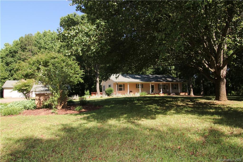 4365 Rimer Road Concord, NC 28025 - Photo 3 of 44 a front view of a house with a garden
