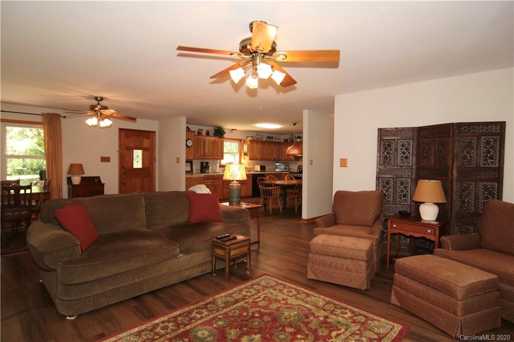4365 Rimer Road Concord, NC 28025 - Photo 22 of 44 a living room with furniture and a chandelier