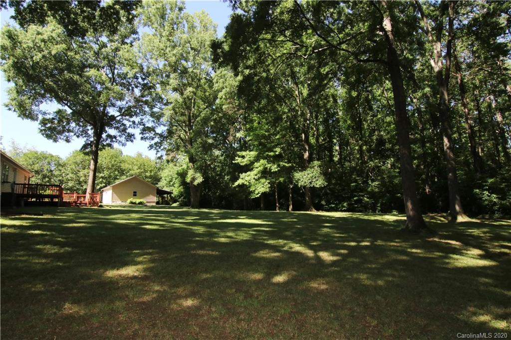 4365 Rimer Road Concord, NC 28025 - Photo 8 of 44 a backyard of a house with a table and chairs
