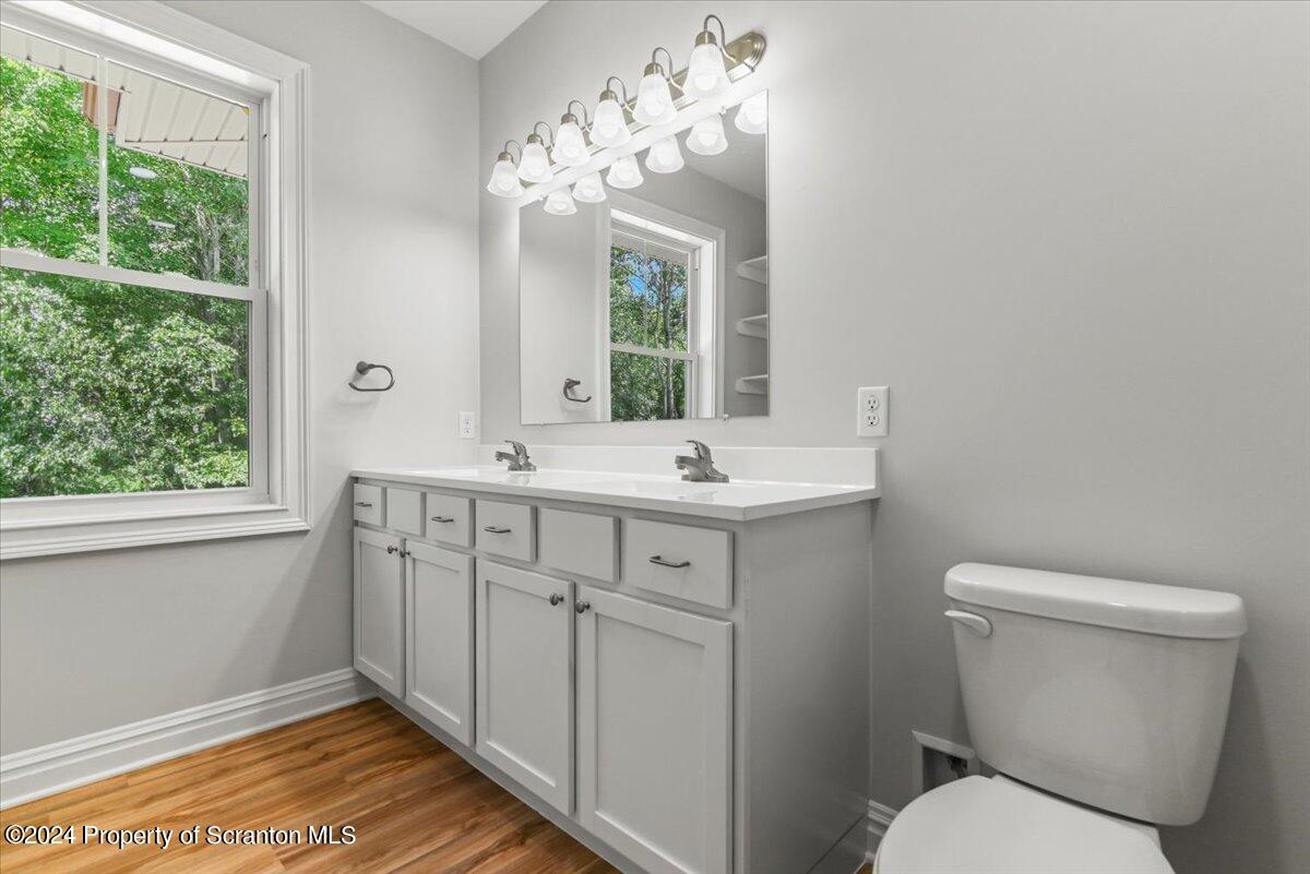 3 Dunbar Way Old Forge, PA 18518 - Photo 13 of 29 a bathroom with a toilet sink and mirror