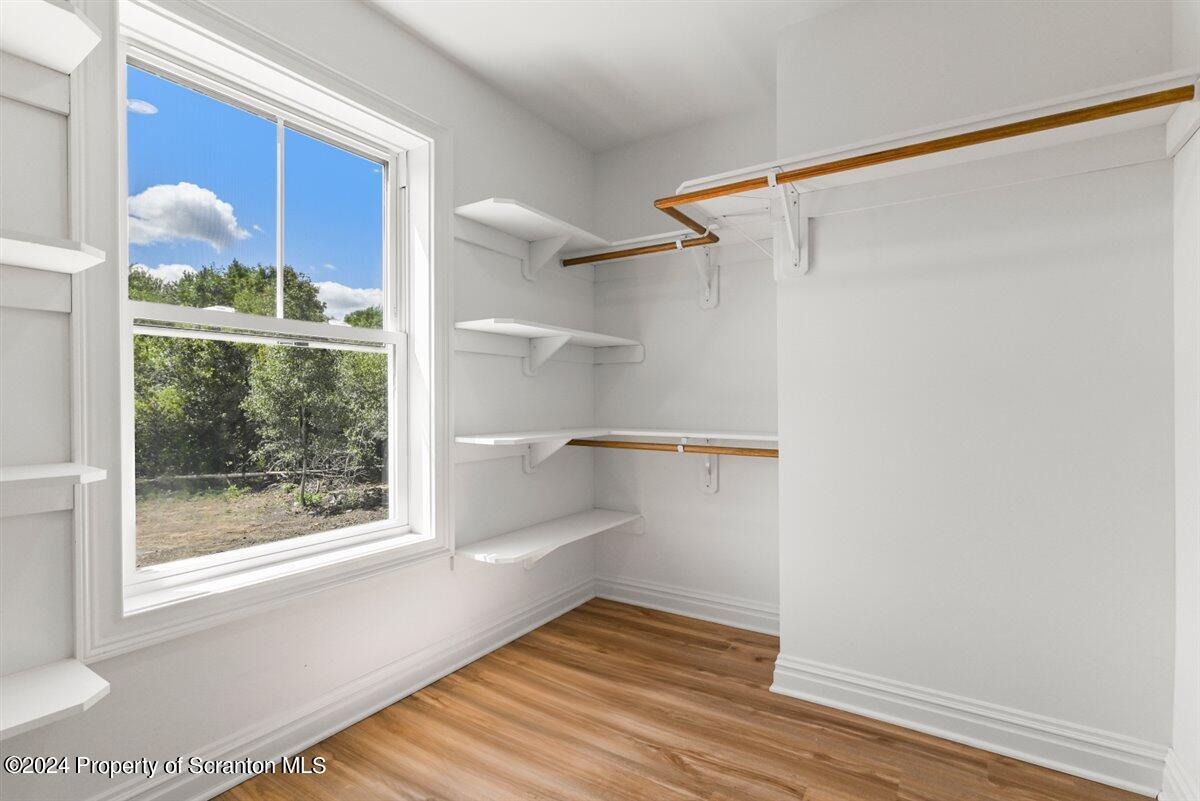 3 Dunbar Way Old Forge, PA 18518 - Photo 21 of 29 a view of a small space with wooden floor and a window