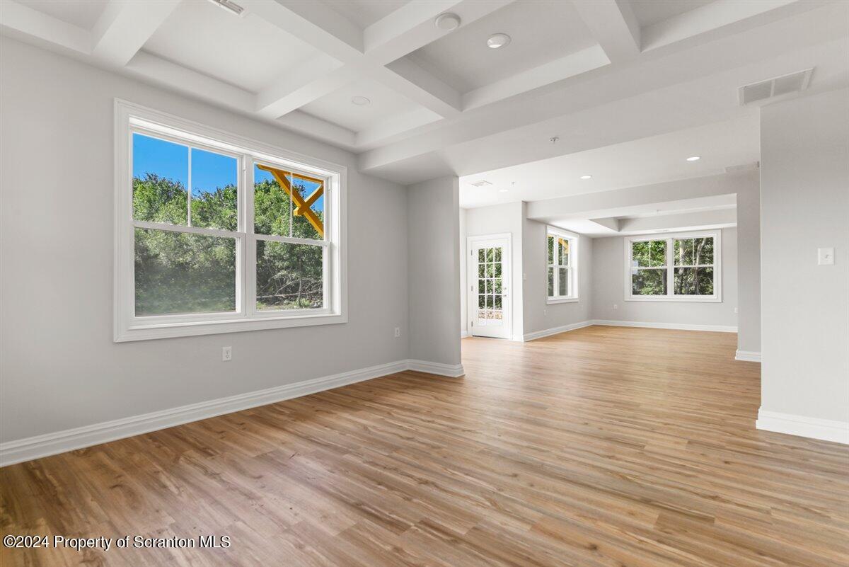 3 Dunbar Way Old Forge, PA 18518 - Photo 28 of 29 an empty room with wooden floor and windows