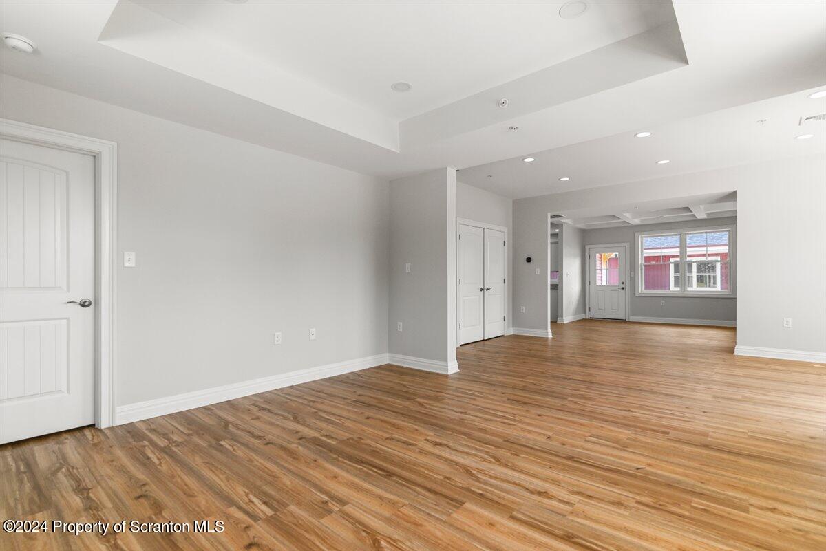 3 Dunbar Way Old Forge, PA 18518 - Photo 29 of 29 a view of an empty room with wooden floor and a window