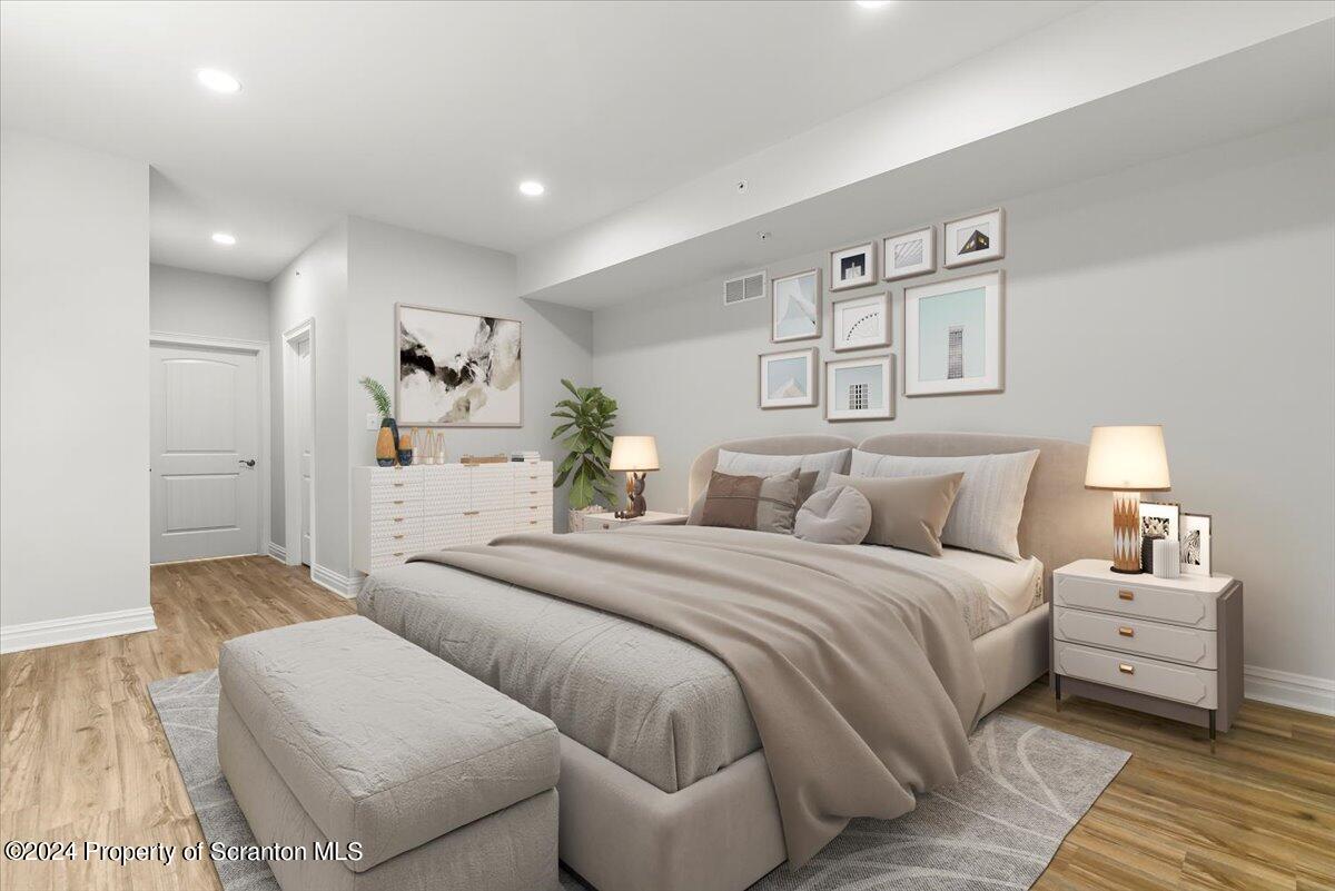 3 Dunbar Way Old Forge, PA 18518 - Photo 7 of 29 a bedroom with a large bed and a couch