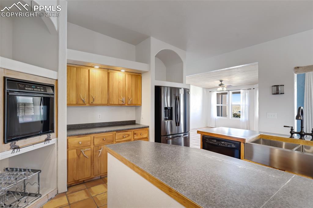 18450 Eurich Road Calhan, CO 80808 - Photo 11 of 48 a kitchen with stainless steel appliances granite countertop a sink and a stove top oven