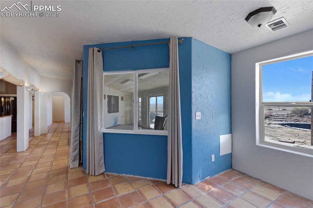 18450 Eurich Road Calhan, CO 80808 - Photo 20 of 48 a view of hallway with a large mirror and a sink