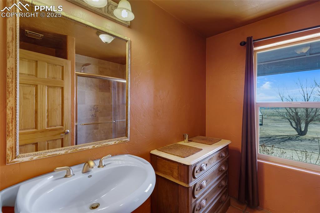 18450 Eurich Road Calhan, CO 80808 - Photo 23 of 48 a bathroom with a sink and a mirror