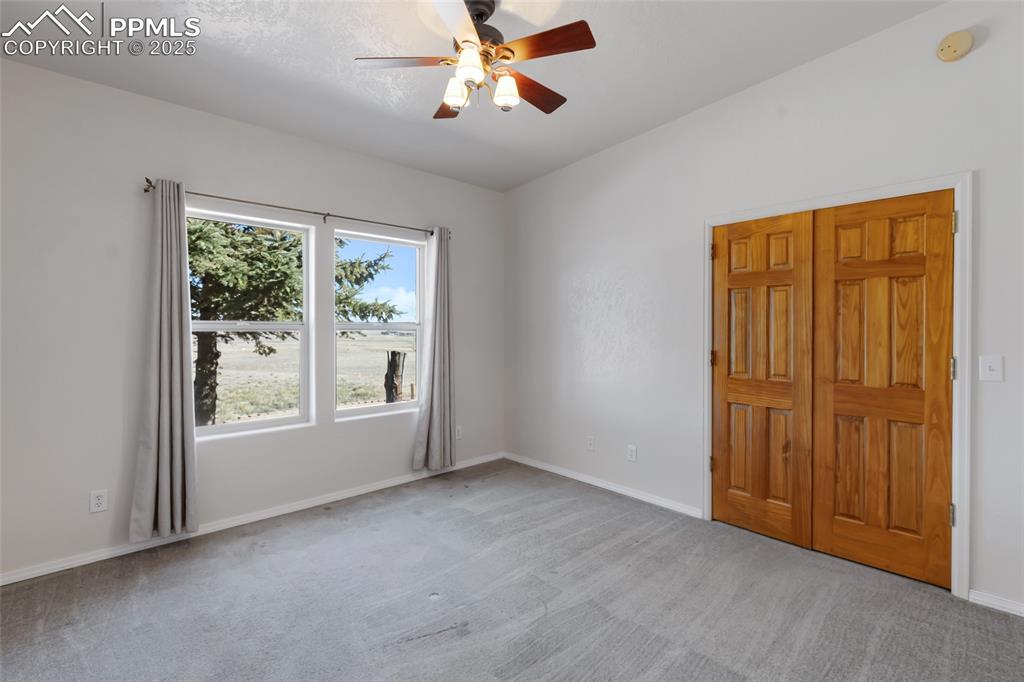 18450 Eurich Road Calhan, CO 80808 - Photo 25 of 48 wooden floor in an empty room with a window