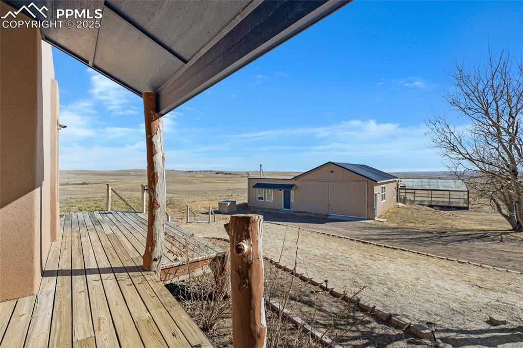 18450 Eurich Road Calhan, CO 80808 - Photo 29 of 48 a view of a roof with wooden floor and city view