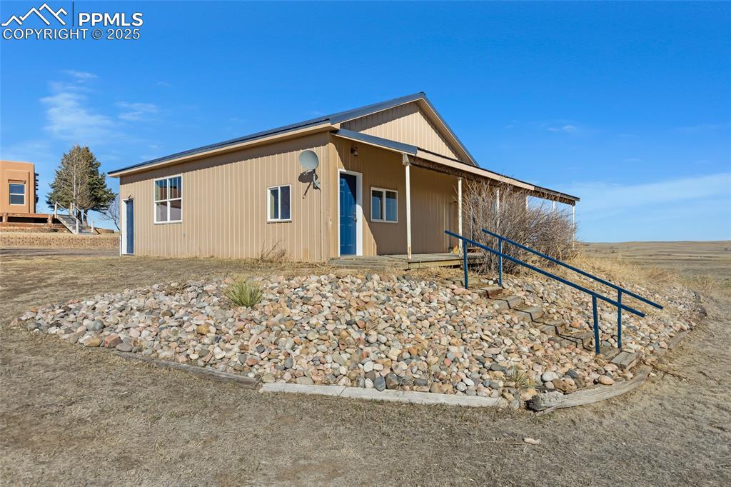 18450 Eurich Road Calhan, CO 80808 - Photo 34 of 48 a front view of house with yard