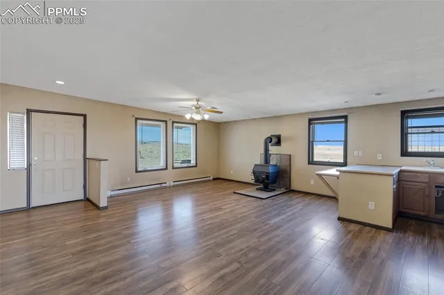 a view of a kitchen with a sink and a living room