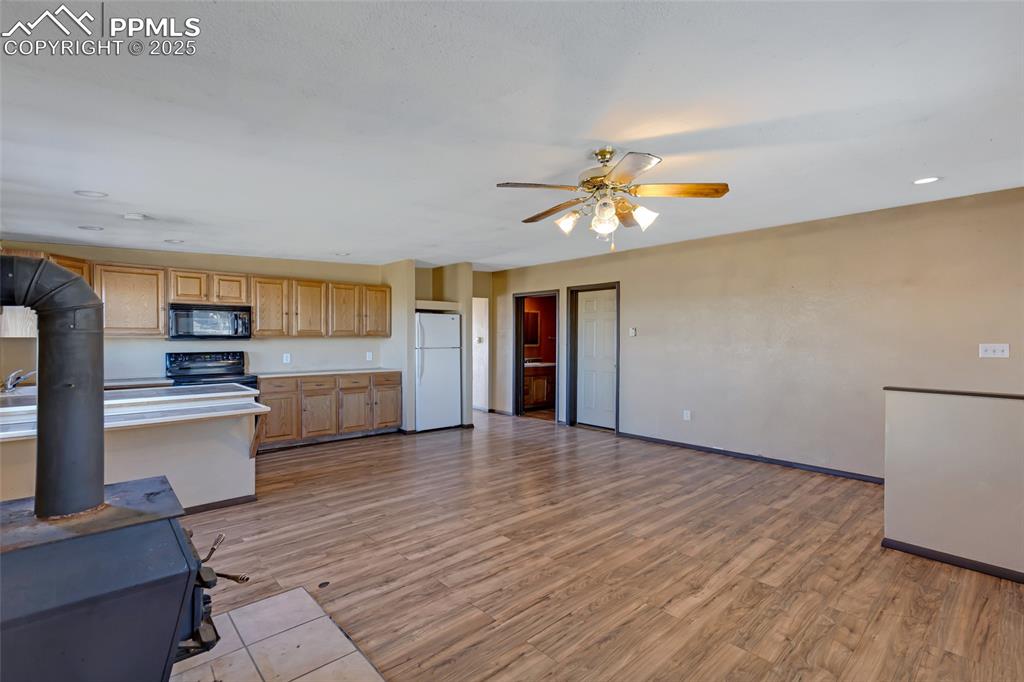 18450 Eurich Road Calhan, CO 80808 - Photo 38 of 48 a view of a kitchen with a sink and a living room