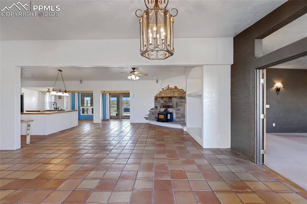 18450 Eurich Road Calhan, CO 80808 - Photo 4 of 48 a view of a hallway with wooden floor and a kitchen