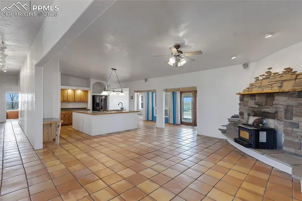 a view of living room with furniture and fireplace