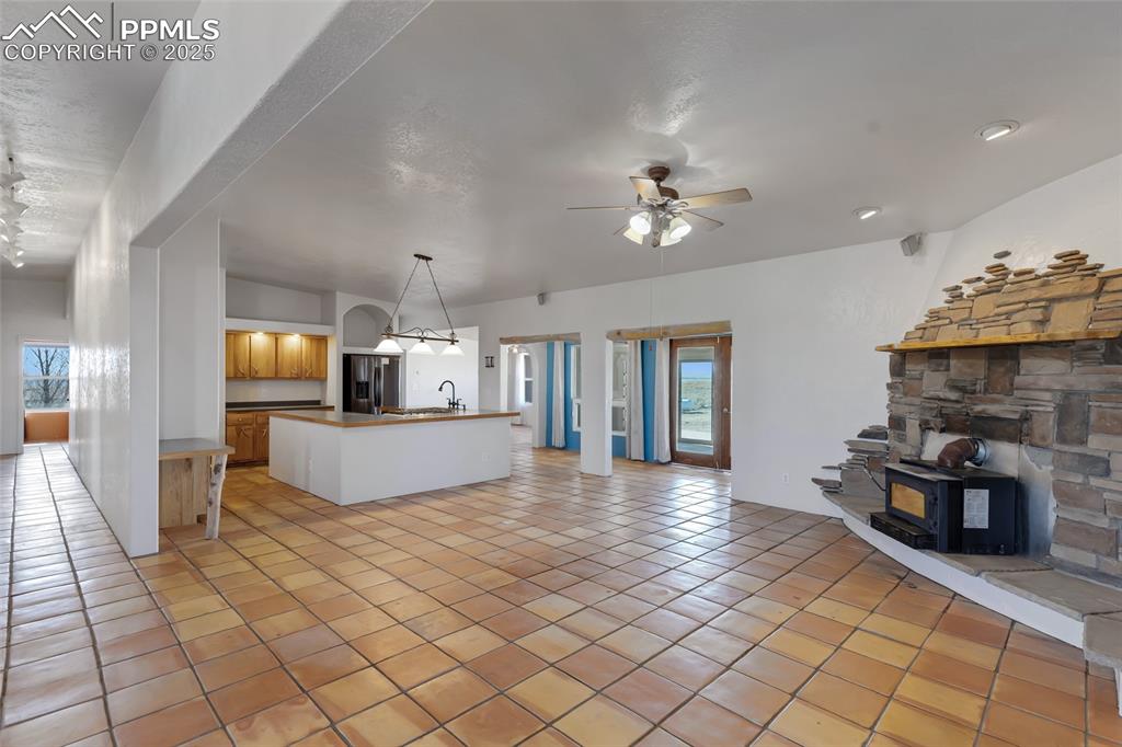 18450 Eurich Road Calhan, CO 80808 - Photo 6 of 48 a view of living room with furniture and fireplace