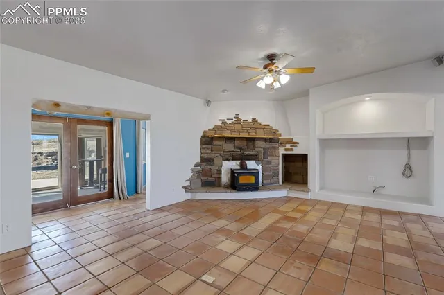 a view of an empty room with a fireplace