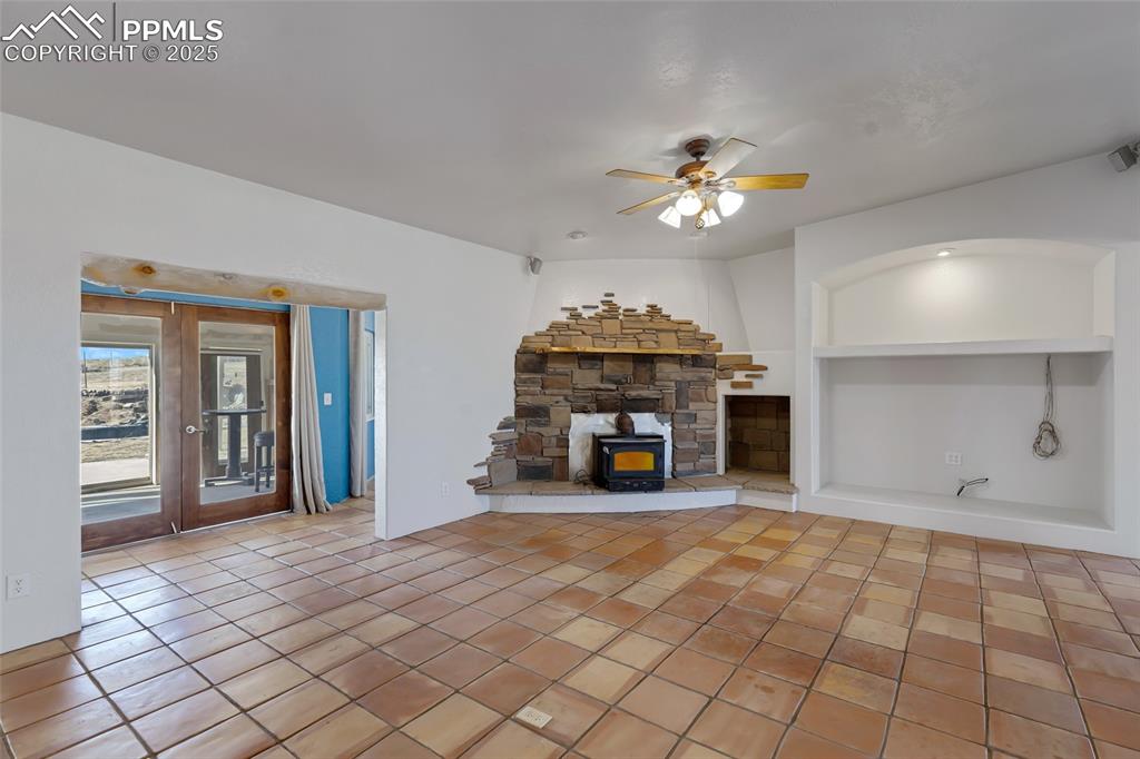 18450 Eurich Road Calhan, CO 80808 - Photo 7 of 48 a view of an empty room with a fireplace