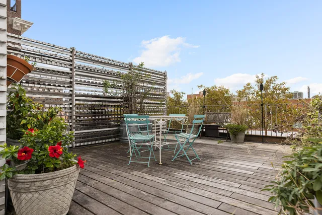 a view of a chairs and table on the wooden floor