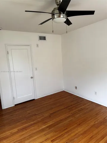 a view of small space with wooden floor