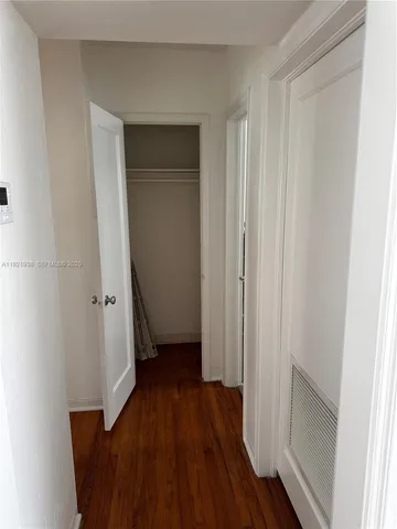 a view of a room with wooden floor and staircase