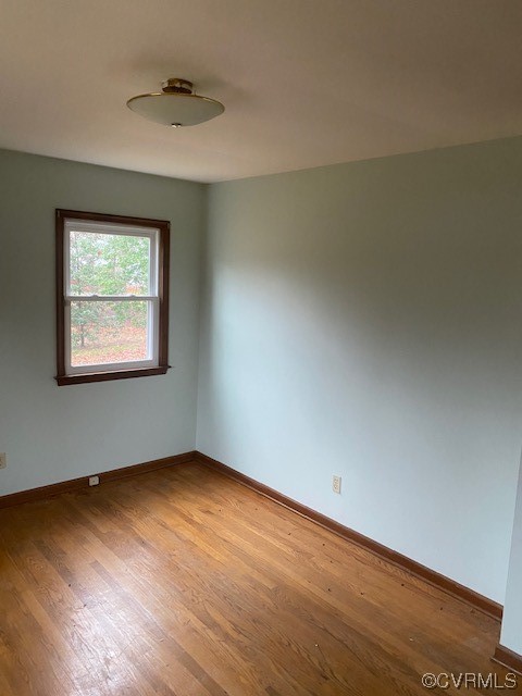 5600 Qualla Road Chesterfield, VA 23832 - Photo 6 of 6 an empty room with wooden floor and windows
