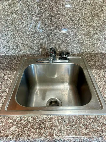 a view of a dining room with furniture and window