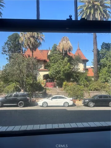 a view of a room with wooden floor and pool table