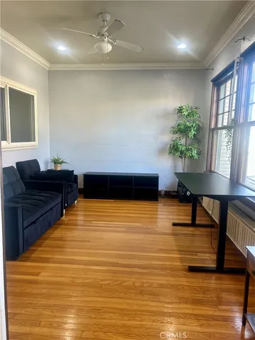 a living room with furniture and a pool table
