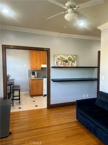 a living room filled with furniture window and hardwood floor