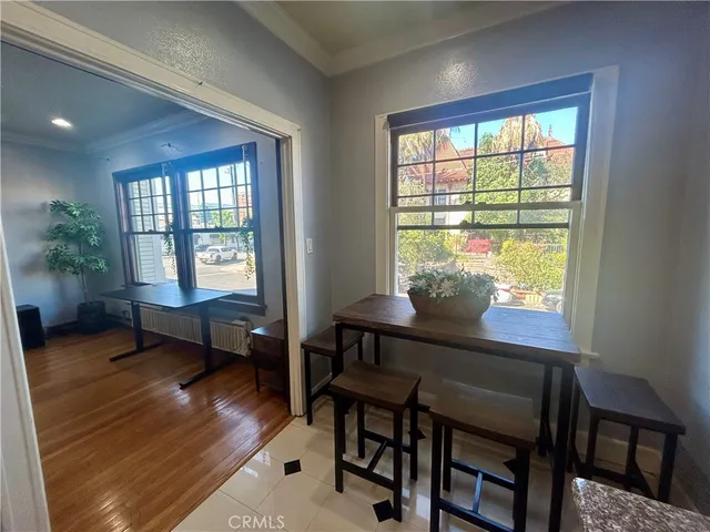 a kitchen with stainless steel appliances kitchen island granite countertop a sink and cabinets