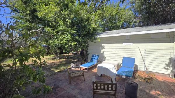 a view of outdoor sitting area with furniture