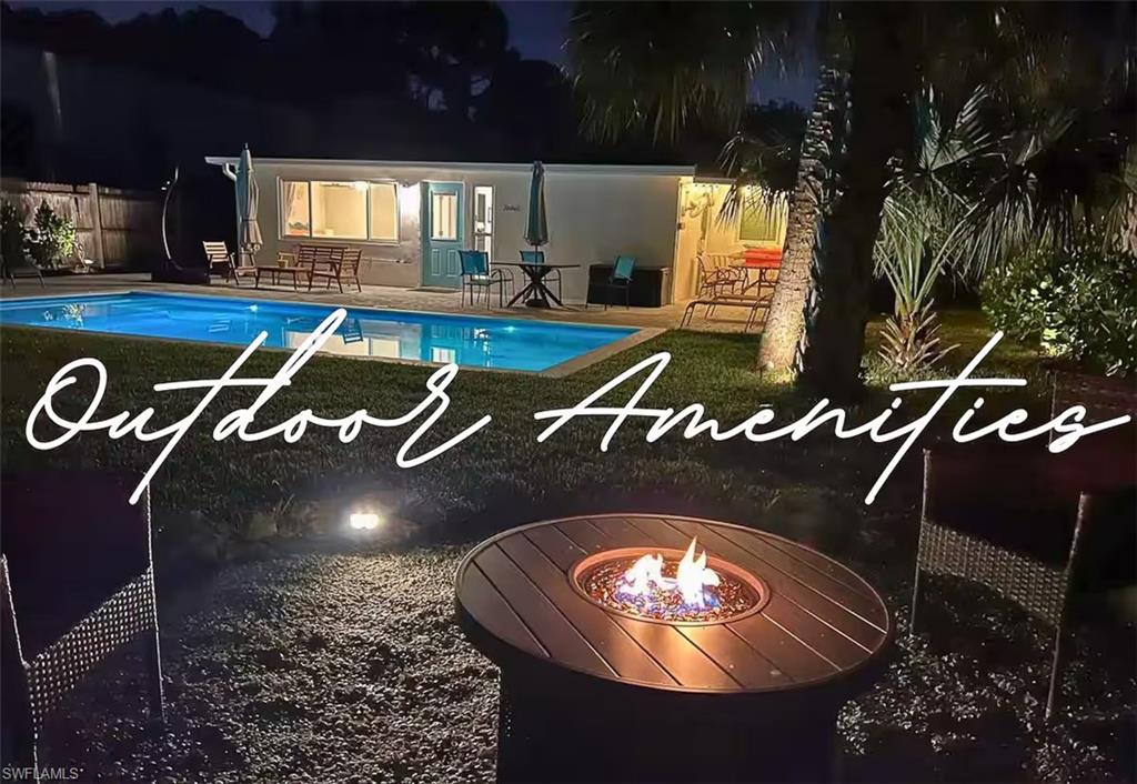 3024 Estey Avenue Naples, FL 34104 - Photo 15 of 19 a living room with a fireplace a rug and a potted plant