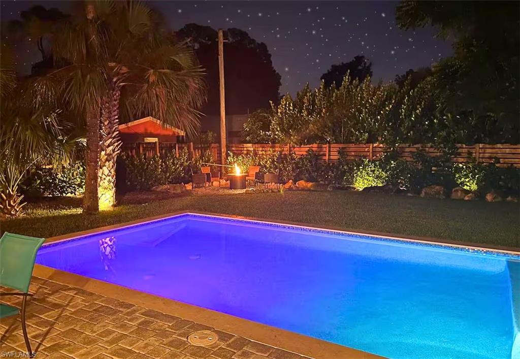 3024 Estey Avenue Naples, FL 34104 - Photo 3 of 19 a view of swimming pool with an outdoor space and seating area