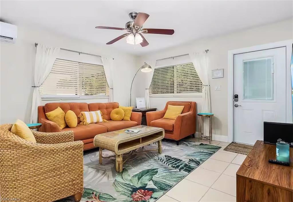 3024 Estey Avenue Naples, FL 34104 - Photo 5 of 19 a living room with furniture and a large window