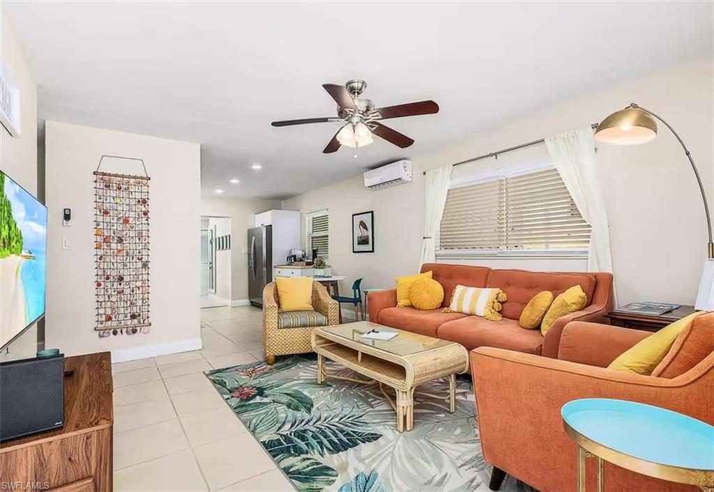 3024 Estey Avenue Naples, FL 34104 - Photo 9 of 19 a living room with furniture a rug and a window