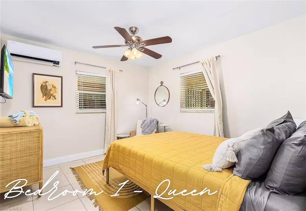 3024 Estey Avenue Naples, FL 34104 - Photo 10 of 19 a bedroom with a bed and wooden floor