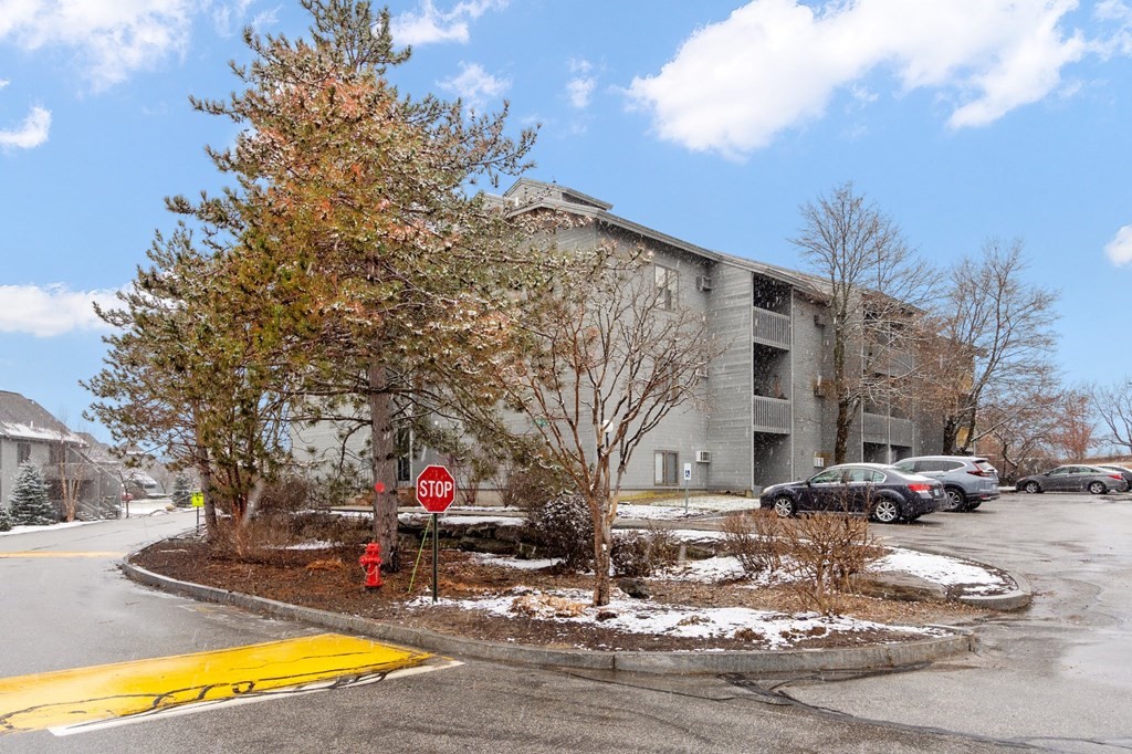 5 Tsienneto Road, Unit 198 Derry, NH 03038 - Photo 1 of 21 a view of street with parked cars