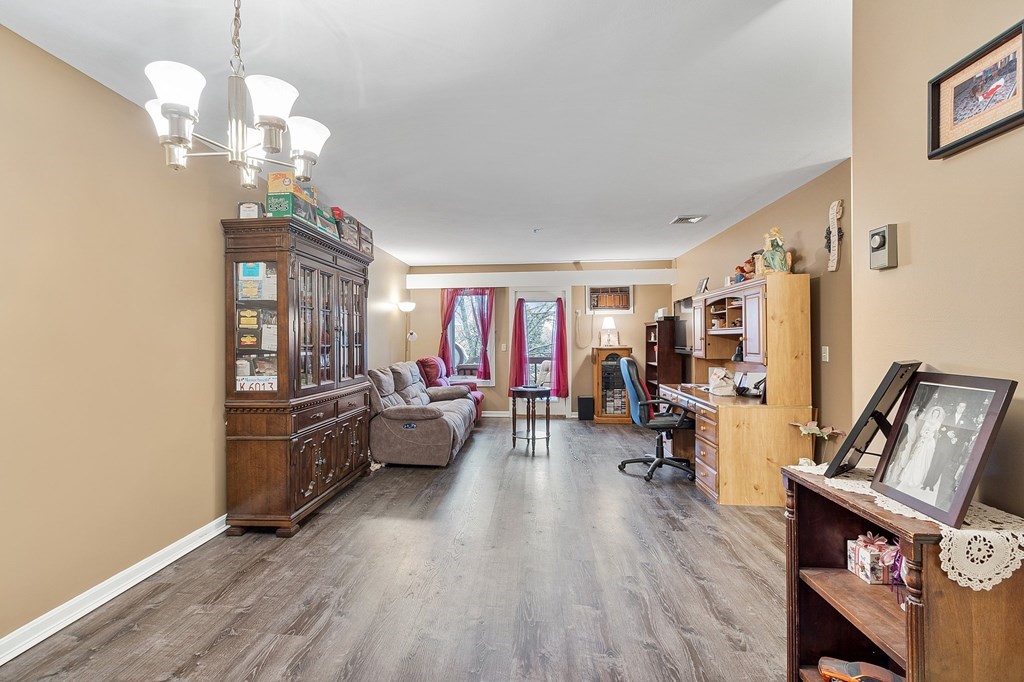 5 Tsienneto Road, Unit 198 Derry, NH 03038 - Photo 13 of 21 a living room with furniture and a wooden floor