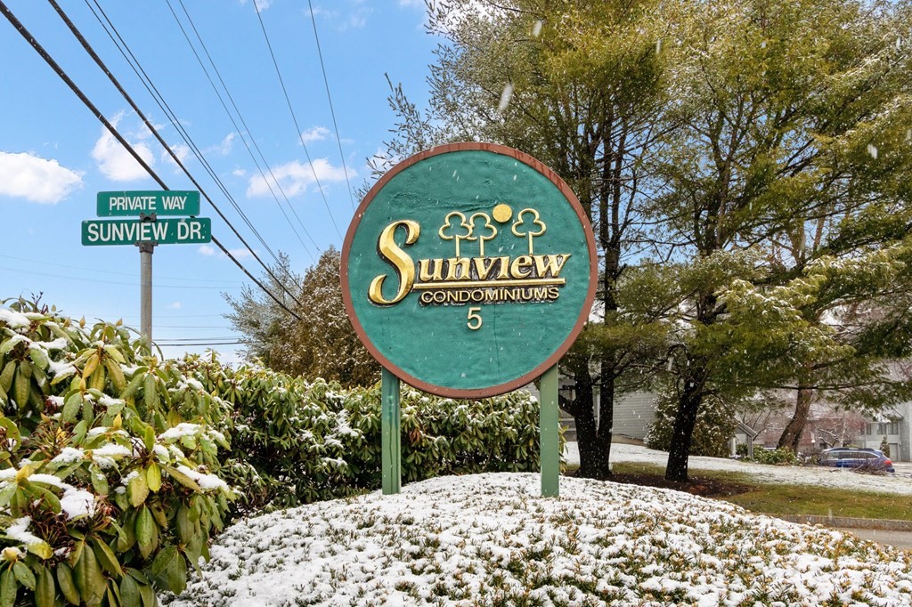 5 Tsienneto Road, Unit 198 Derry, NH 03038 - Photo 20 of 21 a sign that is sitting on a brick wall
