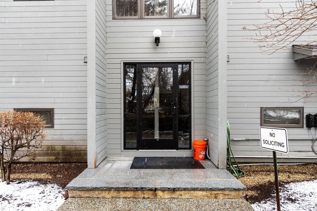 5 Tsienneto Road, Unit 198 Derry, NH 03038 - Photo 2 of 21 a front view of a house with street