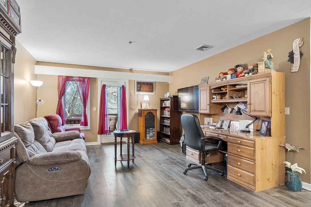 5 Tsienneto Road, Unit 198 Derry, NH 03038 - Photo 9 of 21 a view of a livingroom with workspace and a window