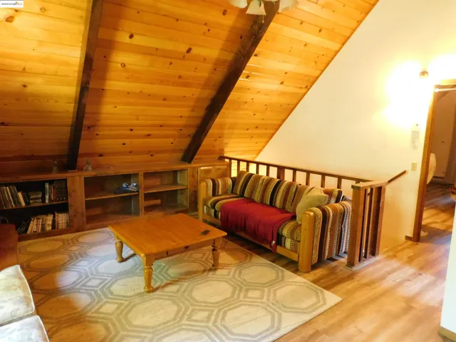 a kitchen with stainless steel appliances kitchen island granite countertop a stove and a sink